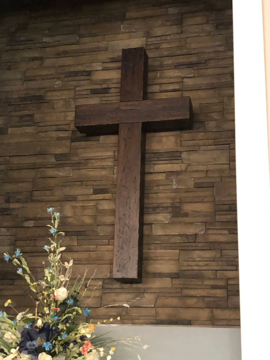 Wall mount wood cross with adjustable LED lighting.